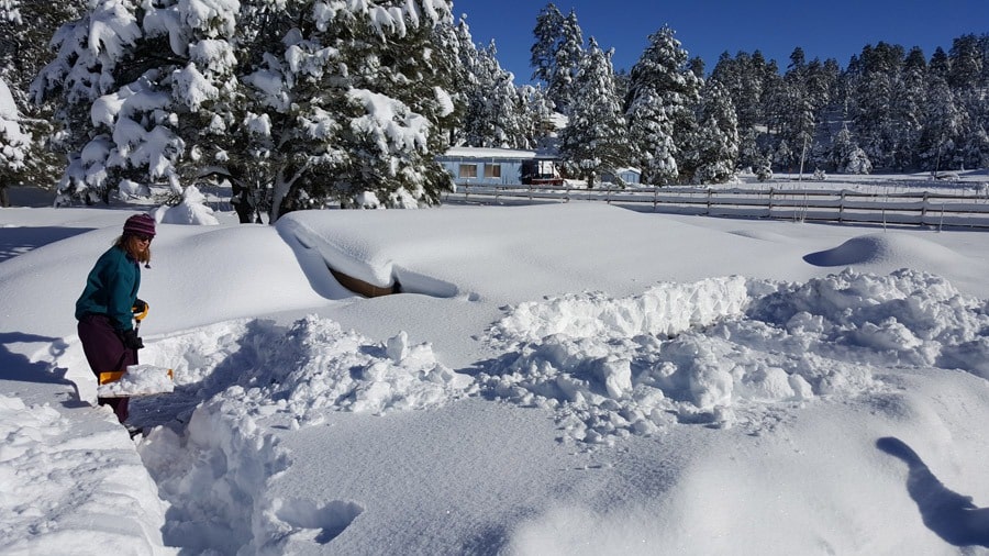 Solexx Walipini greenhouse covered in heavy snow